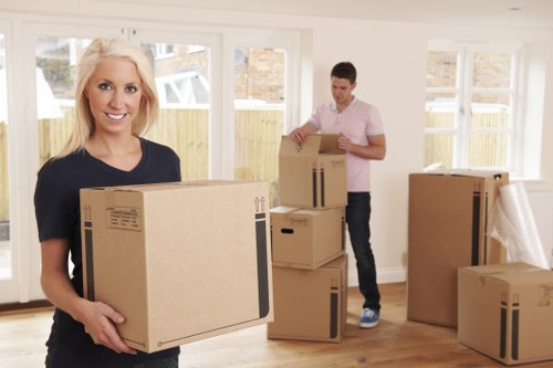Professional office relocation team packing workplace equipment in Denmark