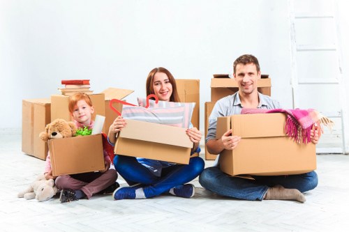 Trained movers handling furniture carefully during relocation