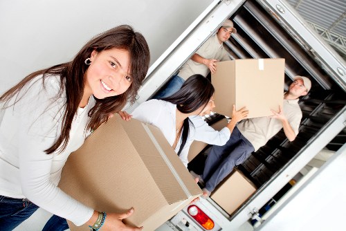 Removal team packing and loading household items in Denmark