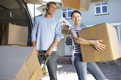 Professional movers handling flat removals in a Danish city building