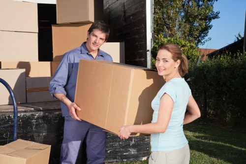 Packed office boxes and labeled workplace equipment